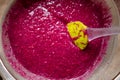 Sieving raspberry puree Royalty Free Stock Photo