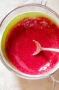 Sieving raspberry puree