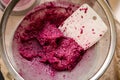 Sieving raspberry puree Royalty Free Stock Photo