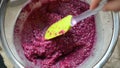 Sieving raspberry puree- video