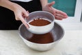 Sifting cocoa powder