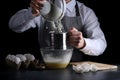 Sifting flour on dark background. recipe of pie or cake making concept Royalty Free Stock Photo