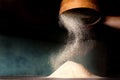 Sifting flour from old sieve. Royalty Free Stock Photo