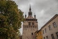 Sighisoara Clock Tower Turnul cu Ceas during a cloudy fall afternoon. It is the main entrance of Sighisoara castle, in Romania