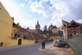 Old man with a cane walking on the street in Sighisoara Royalty Free Stock Photo