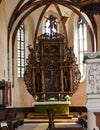 Sighisoara, Romania - July 2, 2019: Interior of the Church of the Dominican Monastery in Sighisoara. The bronze baptismal font