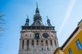 Functional medieval clock on the tower with moving hand carved wood dolls.