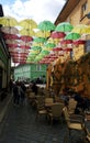 SIGHISOARA, ROMANIA - September 19, 2021: Suspended umbrellas over a old street in Sighisoara