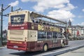 Sight seeing tourist bus passing through Galata Bridge, famous bridge that spans the Golden Horn in Istanbul, Turkey.