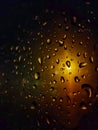 The sight of the sun rising at the crack of dawn and the rain falling on the windowsill Royalty Free Stock Photo