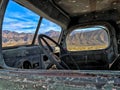 A sight through the window of an old truck; Ballarat, Death Valley National Park, California, USA