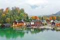 A sightseeing boat cruising on Konigssee  King`s Lake  surrounded by colorful autumn trees Royalty Free Stock Photo