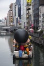 A sightseeing boat making its way along Dotonbori canall in Osaka Japan