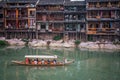 Sightseeing boat with tourists in Fenghuang