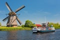 Sightseeing boat with tourists in Kinderdijk Royalty Free Stock Photo