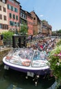 Sightseeing cruise in Strasbourg with passenger boat passing through the river locks on the canals in the historic old town