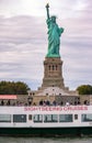 New York, New York - October 11, 2019 : Tourists visiting the Statue of Liberty and Ellis Island on a sightseeing ferry