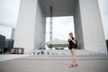 Sightseeing guide. Girl tourist sunglasses enjoy city center square. Woman stand in front of urban architecture. Must Royalty Free Stock Photo