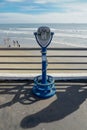 Sightseeing retro style binoculars with beach background Oceanside Pier