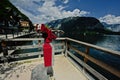 Sightseeing tourist coin operated telescope at watching point with scenic view at Hallstatt, Salzkammergut, Austria