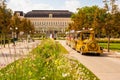 Sightseeing train drives tourists through the park in front of