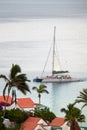 a sightseeingn catamaran with many tourists returns to the port Royalty Free Stock Photo