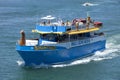 Sightseer taking s group of tourist on a dolphin and whale watch Royalty Free Stock Photo