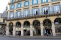 Sightseers shopping under archways of shops,Paris,France,2016