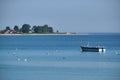 Sigle boat and Rewa Peninsula in the background, Poland Royalty Free Stock Photo