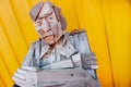 SIGLUFJORDUR, ICELAND - 15 August 2012: Sitting wooden statue with colorful background, Siglufjordur, Iceland