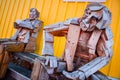 SIGLUFJORDUR, ICELAND - 15 August 2012: Sitting wooden statue with colorful background, Siglufjordur, Iceland