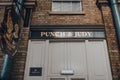 Sign above closed doors of Punch & Judy pub in Covent Garden Market, London, UK