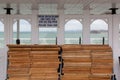 A sign above deck chairs on a pier reading that deckchairs are free to use on the pier at the British seaside Royalty Free Stock Photo