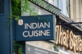 Sign above an Indian restaurant on The Strand, London