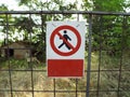 Sign Access forbidden all unauthorized persons with text in Italian attached to fence Royalty Free Stock Photo