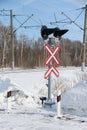 Sign adjustable railway crossing equipped with a semaphore, signal columns Royalty Free Stock Photo