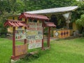 A sign advertises fresh fruit for sale at a roadside stand on the road to hana Royalty Free Stock Photo