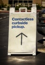 Sign advertising Contactless Curbside Pickup at retail store parking lot Royalty Free Stock Photo