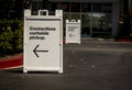 Sign advertising Contactless Curbside Pickup at retail store parking lot