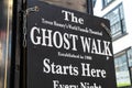 Sign advertising the start of a ghost walk visitor tourist attraction