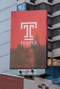 Sign advertising Temple University as seen on the side of a building in center city Philadelphia