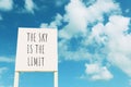 Sign against blue sky with clouds with the text Ã¢â¬â the sky is the limit Royalty Free Stock Photo