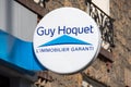Sign of an agency Guy Hoquet. Guy Hoquet is a network of franchised real estate agencies in France Royalty Free Stock Photo