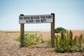 Sign on the beach saying `No dogs beyond this point 1st May - 30th Sept`. Aldeburgh, Suffolk. UK