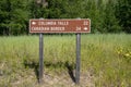 SIgn along North Fork Road in Glacier National Park - Columbia Falls and the Canadian Border mileage sign in Montana Royalty Free Stock Photo