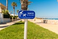 A sign announcing the ban on dogs on the beach in L`Hospitalet de l`Infant, Tarragona, Catalunya, Spain. Copy space. Royalty Free Stock Photo