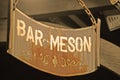 Sign of bar tavern of iron rusty and hung with chains