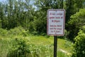 Sign - Bison range gates lock, vehicles must exit in the evening - at Minneopa State Park in Mankato Minnesota Royalty Free Stock Photo
