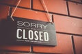 Sorry we are closed sign hang on door of business. Royalty Free Stock Photo