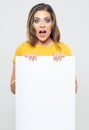 Sign board. Woman holding big white blank card. Royalty Free Stock Photo